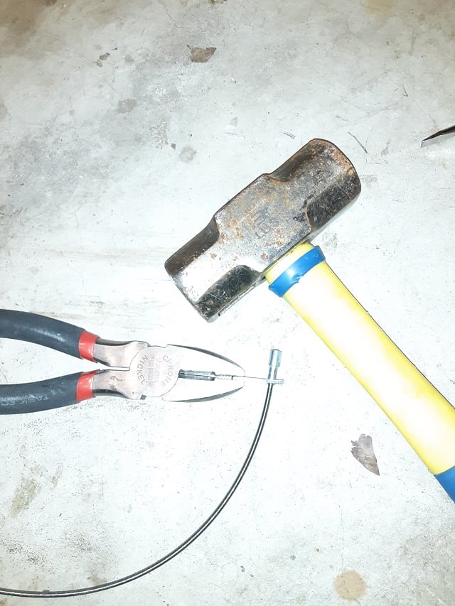 Hold crimping piece with pliers and hit with small maul, or large hammer.