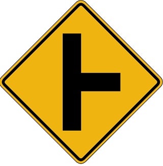 Intersection warning sign, motorcycles beware of people turning left.
