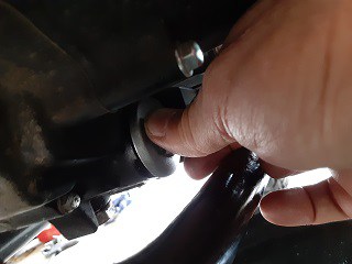 Oil filter cap threading by hand.