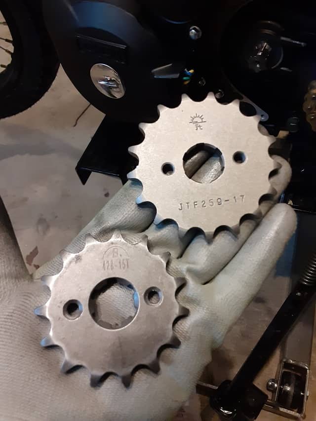 New TBR7 front sprocket next to stock front sprocket