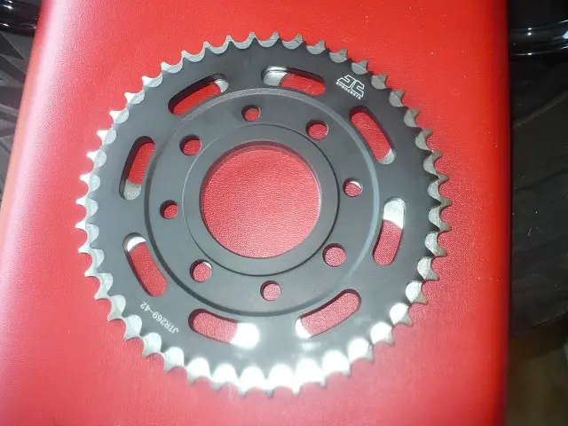 New sprocket on top of old sprocket.  4 teeth size difference.