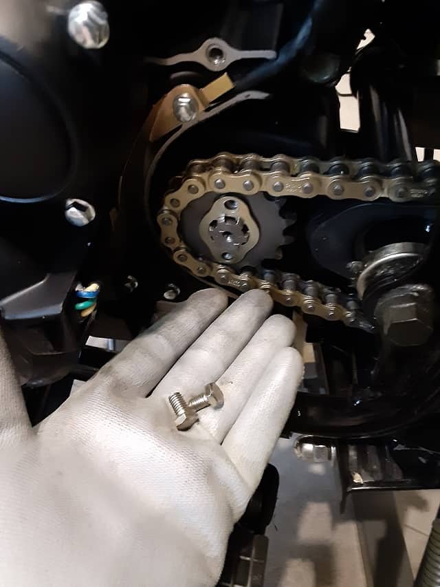 Bolts removed from sprocket locking plate.