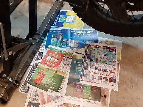 Newspapers on floor for possible mess.