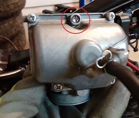 The carburetor air/fuel mixture screw.