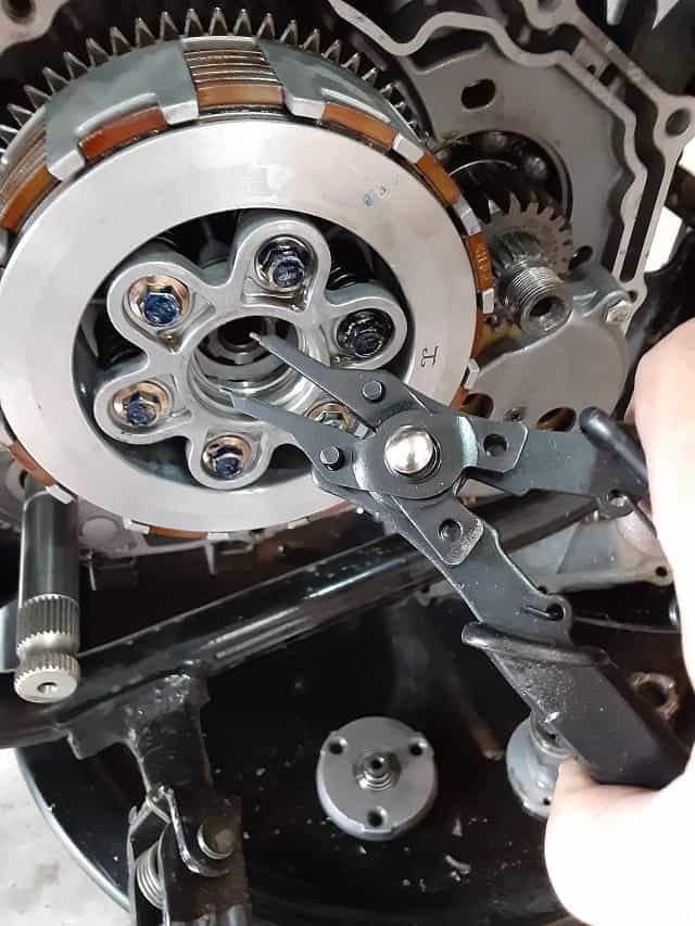 Removing clutch snap ring.