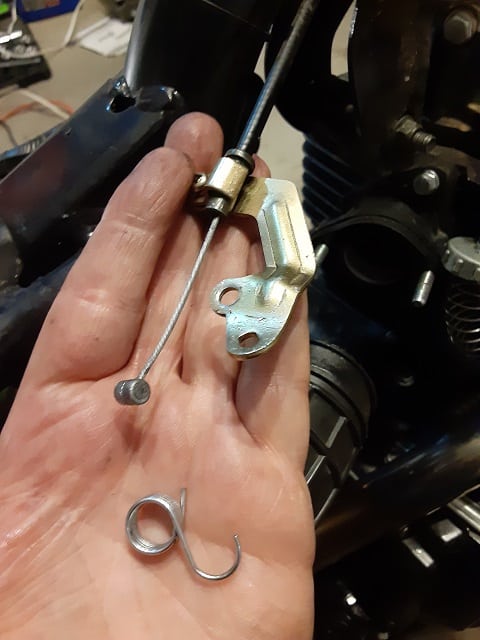 Choke cable removed from stock carburetor, ready for the Mikuni carburetor. 