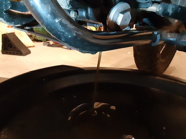Draining oil from the TaoTao TBR7 motorcycle.