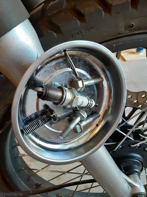 Magnetic parts tray attached to TBR7 motorcycle fork.