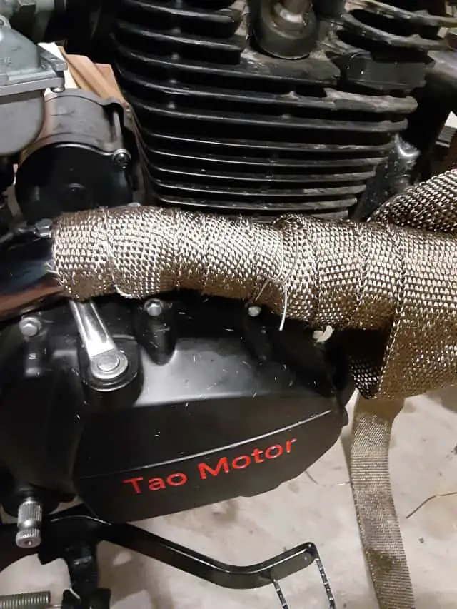 Using Temp wire to hold loops of exhaust wrap.