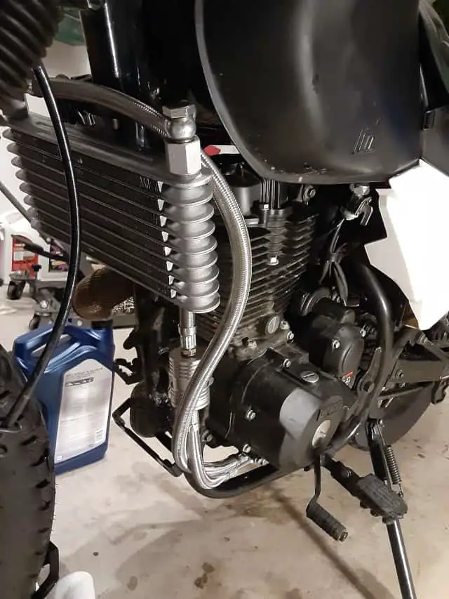 Oil lines mounted to and from motorcycle oil cooler.