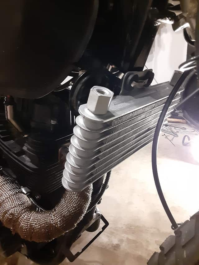 New motorcycle oil cooler mounted.