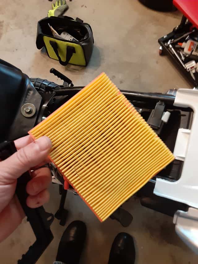 Holding the TaoTao TBR7 Stock Motorcycle Air Filter.