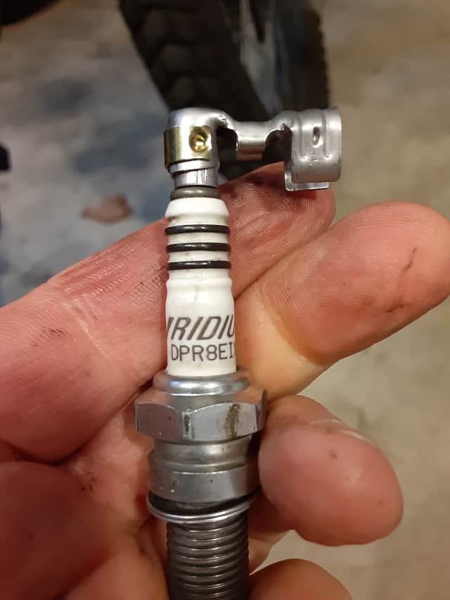 Testing terminal connections to spark plug.