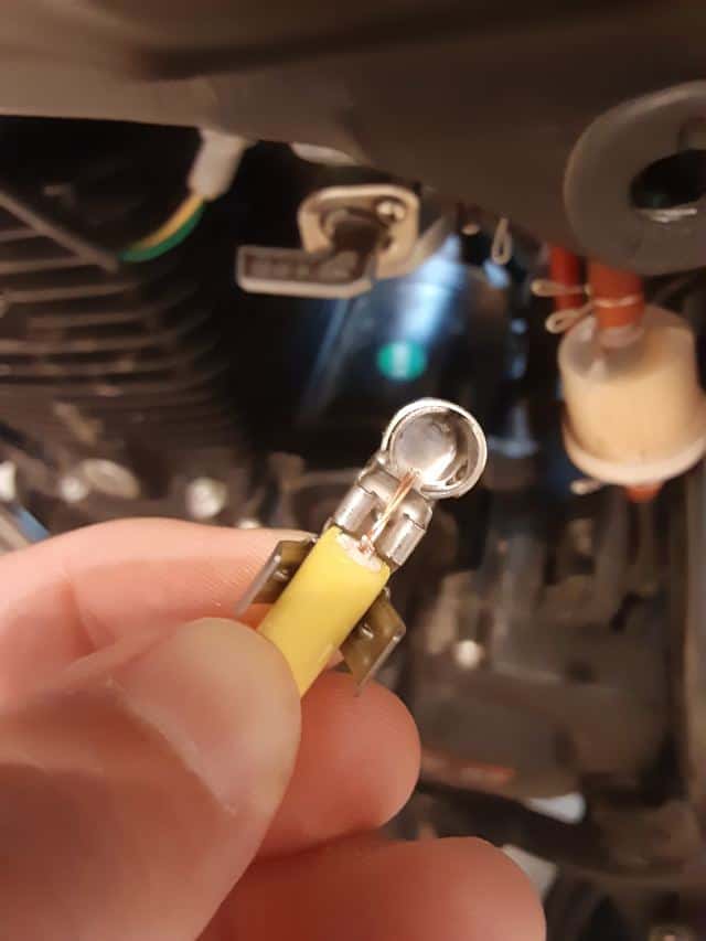Nibbi spark plug wire lined up for crimping.