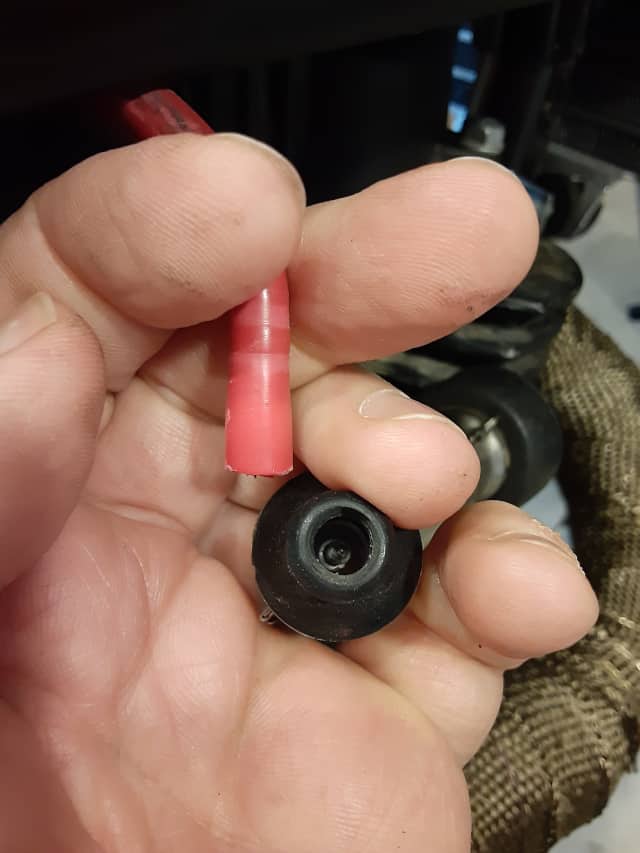 Stock Spark Plug Boot unscrewed from ignition wire.