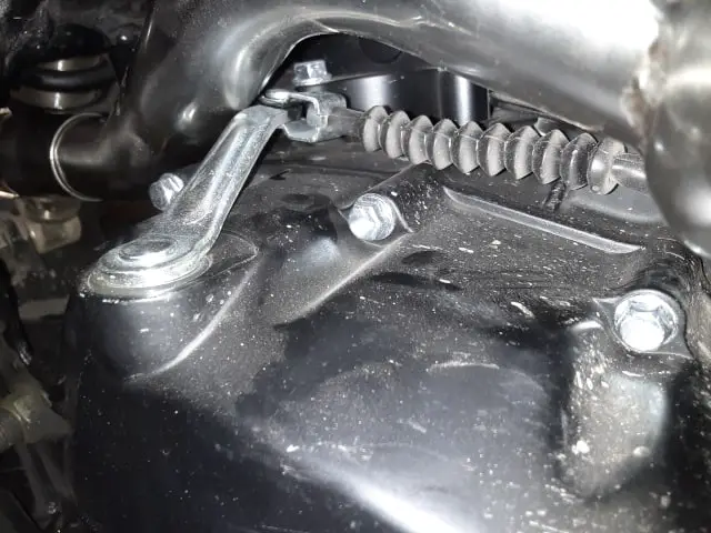 Engine clutch lever making contact with upgraded exhaust piping.