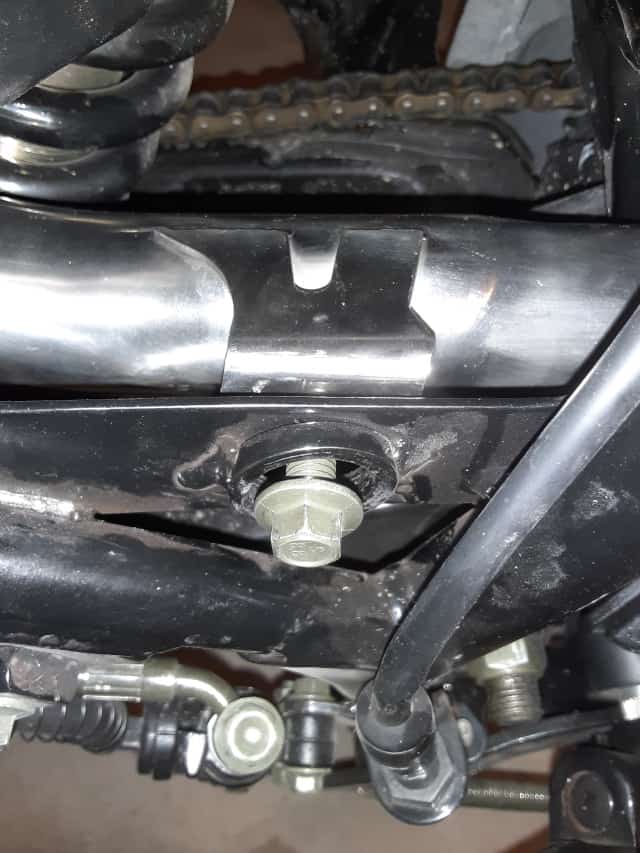 Checking mounting bolt of exhaust system.