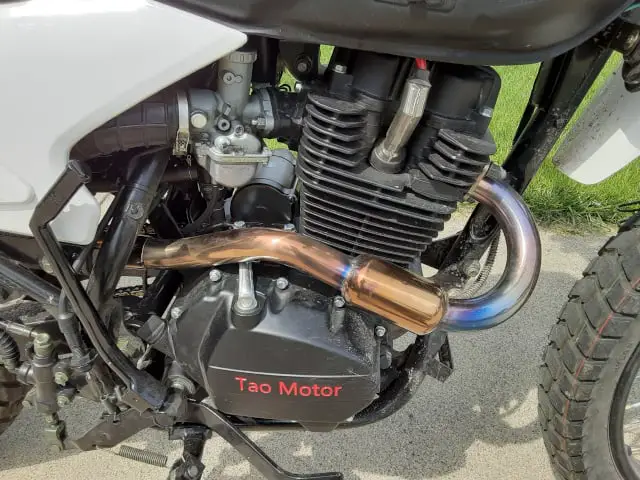 Heating action changing colors of upgraded motorcycle exhaust system.