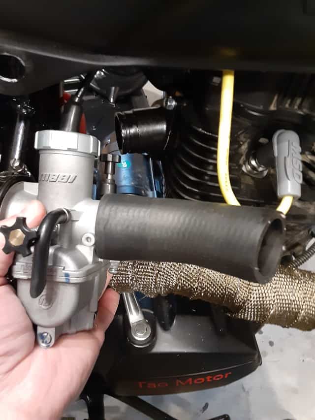 Radiator hose dry fit to Nibbi Racing Carb outlet.