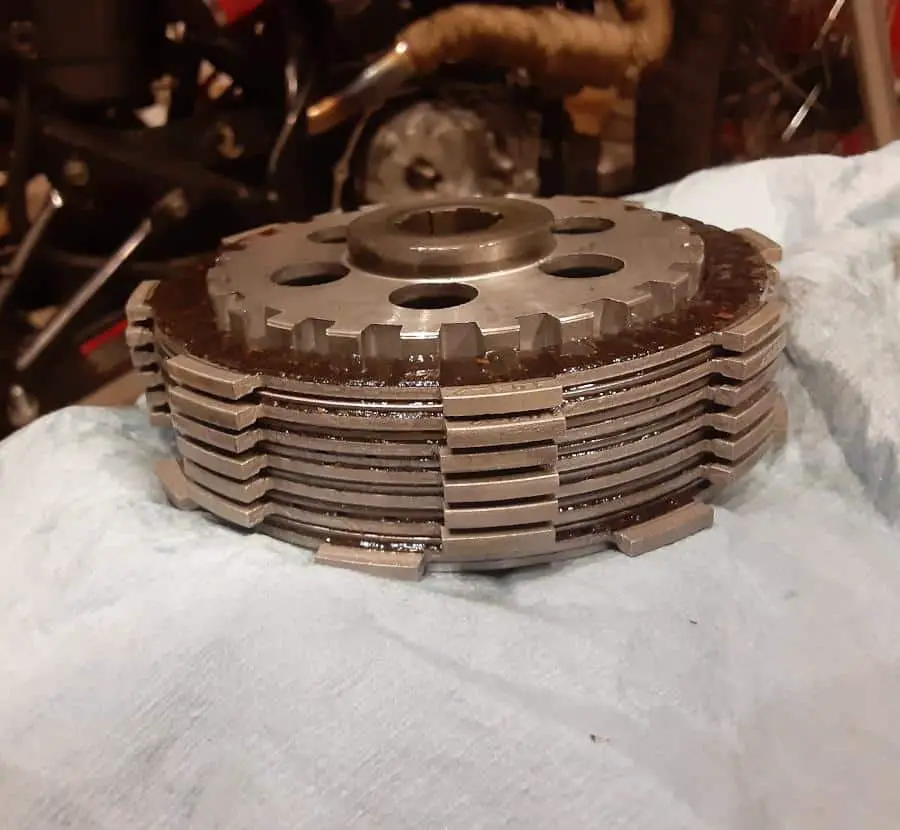 Friction plates and metal drive plates stacked onto clutch center hub.