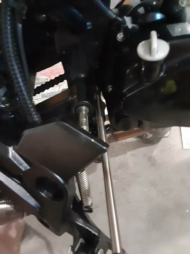 Drilling larger Grom Clone lower engine mount hole.