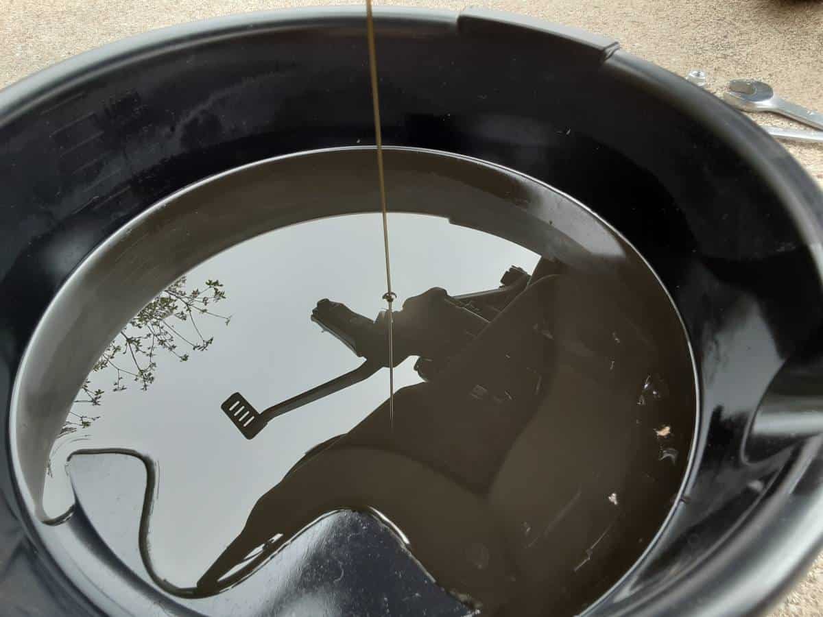 My Motorcycle oil draining into pan.