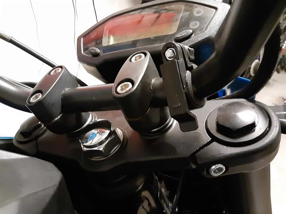 Handlebar mount for cell phone charger mounted.