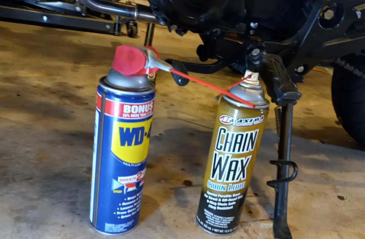 Cans of WD40 and chain wax lube for gear shifter care.