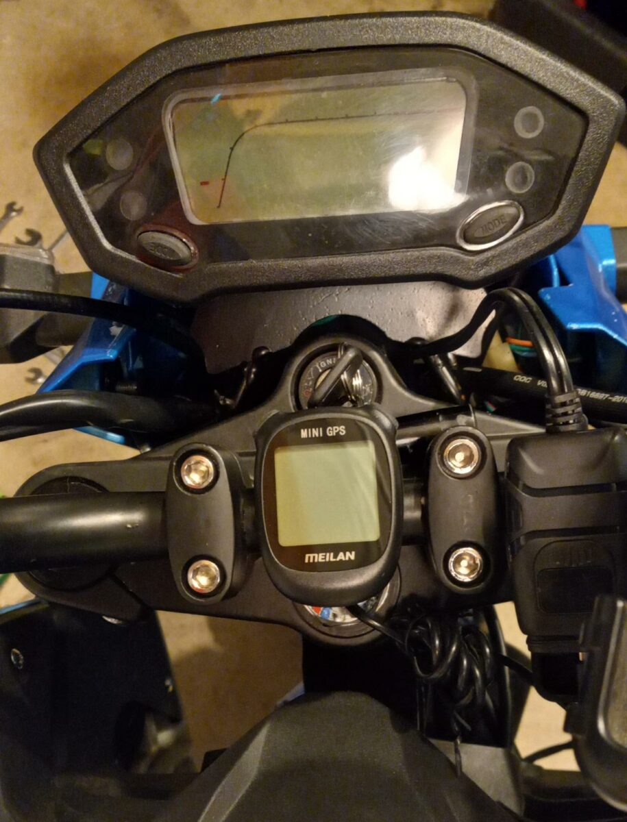 GPS speedometer mounted between the handlebar risers on my Boom Vader motorcycle.