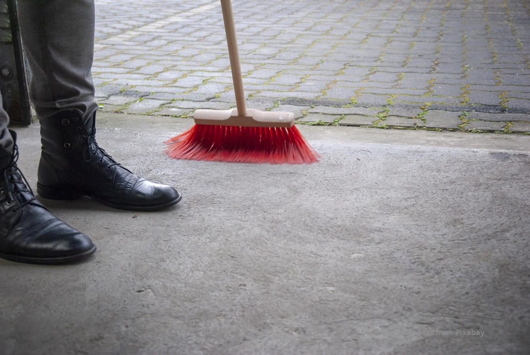 Sweeping Garage Floor, remove slipping hazards. 